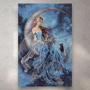 May include: Cross-stitch artwork of a fairy with red hair and blue dress, seated on a crescent moon. The fairy holds flowers and is accompanied by a black cat and butterfly. The background is a dark blue, creating a whimsical scene.