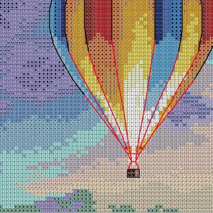 Puede incluir: Patr&oacute;n de punto de cruz de un globo aerost&aacute;tico contra un cielo nublado. El globo es un mosaico de cuadrados rojos, amarillos y azules, con contornos negros y l&iacute;neas de soporte rojas. El cielo pasa de morado a azul.
