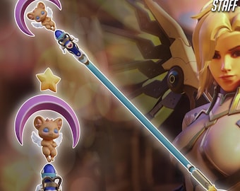 May include: A light blue staff with a detailed design, featuring a bear-like figure with wings, a crescent moon, and stars. The text "MERCY MAGICAL GIRL STAFF" is displayed at the top. The words "3D PRINTER FILES DIGITAL PRODUCT" are at the bottom.