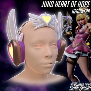 Op de afbeelding: Een 3D-geëngageerd model van een hoofd met een headset met een hartvormig ontwerp. De headset is wit, paars en goud. De tekst "JUNO HEART OF HOPE HEADWEAR" staat bovenaan. De afbeelding bevat ook een digitale productafbeelding.
