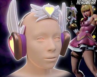 May include: A 3D-rendered model of a head wearing a headset with a heart-shaped design. The headset is white, purple, and gold. The text "JUNO HEART OF HOPE HEADWEAR" is at the top. The image also includes a digital product graphic.