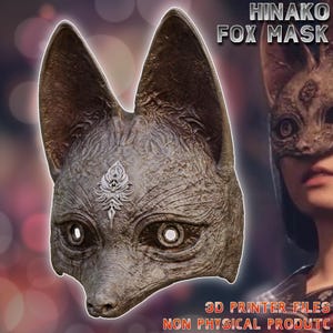 May include: A detailed, textured fox mask in shades of gray and brown, with large pointed ears and open eye sockets. The mask has a decorative silver emblem on the forehead. Text on the image reads "HINAKO FOX MASK" and "3D PRINTER FILES NON PHYSICAL PRODUCTC".