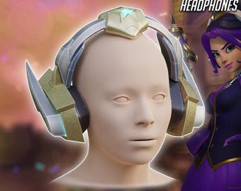May include: A detailed image of headphones with a gold and silver design, resting on a mannequin head. The text "FRESHMAN TEO MINH JUNO HEADPHONES" is at the top, and "3D PRINTER FILES DIGITAL PRODUCT" is at the bottom.