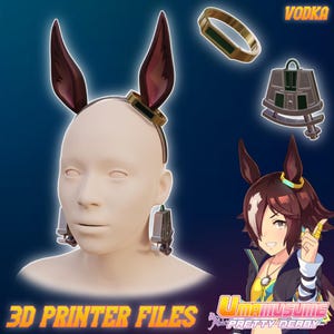 May include: A mannequin head wearing a headband with burgundy bunny ears, earrings, and a gold ring. Additional accessories include a gold and green ring, and a decorative bell. The text "3D PRINTER FILES" is at the bottom.