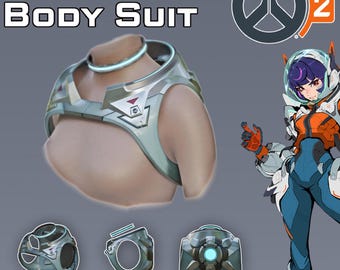 May include: A digital rendering of a Juno body suit, with the text "JUNO BODY SUIT" at the top. The suit is silver and light blue, with a matching neck piece. Below are three additional pieces. The Overwatch 2 logo is in the upper right corner. The text "DIGITAL PRODUCT STL FILES" is at the bottom.