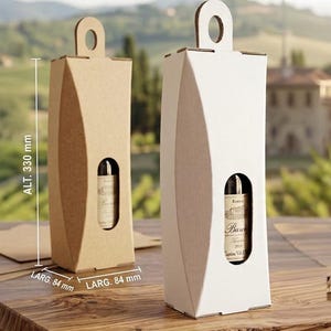 May include: Two tall, rectangular cardboard wine bottle gift boxes, one in natural brown and one in white. Each box features a top handle cutout and a central oval window revealing a wine bottle label. Dimensions are 330 mm high by 84 mm wide.