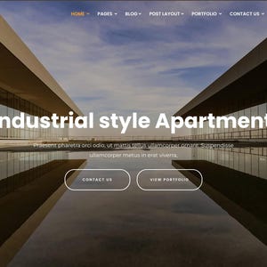 以下が含まれることがあります： インダストリアルスタイルのアパートメントを紹介するウェブサイトのデザイン。画像は、大きな窓と反射するプールを備えたモダンな建物を示しています。「Industrial style Apartment」、「Contact Us」、「View Portfolio」などのテキストが含まれています。Interaのロゴは左上にあります。