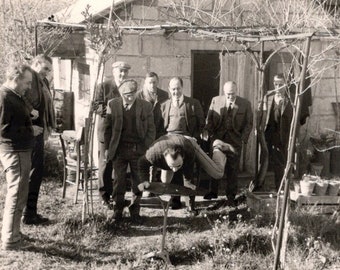 Vintage French Photo - Man Balancing Himself on a Table