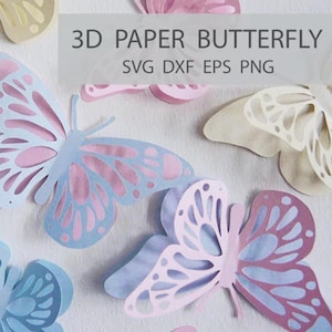 Könnte beinhalten: Eine Ansammlung von 3D-Papier-Schmetterlingen in verschiedenen Pastellfarben, darunter Hellblau, Rosa und Creme. Die Schmetterlinge haben aufwendige Ausschnitte und sind auf einer weißen Oberfläche angeordnet. Der Text auf dem Bild lautet "3D PAPER BUTTERFLY SVG DXF EPS PNG".