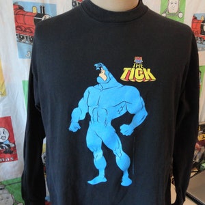 vintage des années 90 The Tick Cartoon TV Show Comic Book Fox Superhero 1996 noir t-shirt à manches longues taille adulte XL