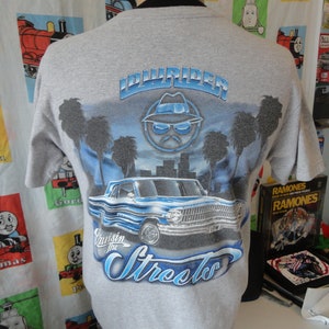 Vintage Lowrider Magazine La Raza Art gray Low Rider T Shirt size M Cholo Azteca Vato Teen Angels