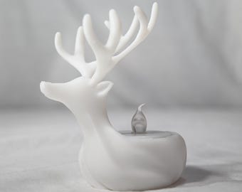 Portavelas de reno navideño: elegante decoración invernal