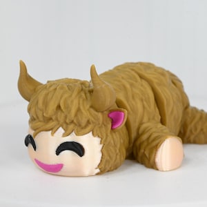 Articulated Highland Cow desk toy.