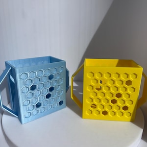 Juice box holder for little kids to stop them squeezing and spilling their juice, helps to make them independant