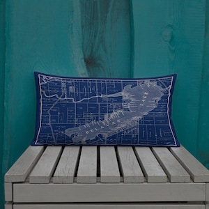 May include: A navy blue throw pillow with a vintage map of Delavan, Wisconsin printed in white. The map shows the streets, waterways, and surrounding areas.