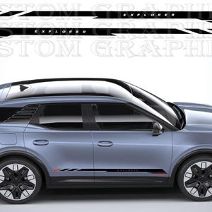 May include: A light blue SUV with black and red accent decals. The decals read "EXPLORER" and are placed on the side of the vehicle. The wheels are black with silver accents. The image also shows the text "CUSTOM GRAPHICS".