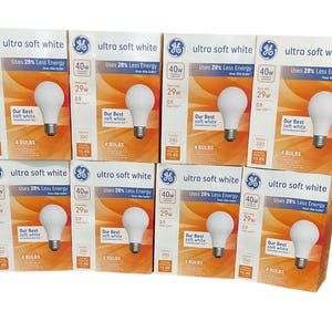May include: A collection of GE Ultra Soft White light bulb boxes. Each box features a 40W bulb, uses 28% less energy, and contains 4 bulbs. The boxes have a white and orange design.