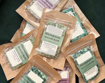 May include: A collection of microgreens grow kit refills in clear plastic pouches, each sealed in a small brown paper bag. The labels display the product name and variety, such as 'Organic Waltham 29 Broccoli'. The text 'Magically Nutritious!' is also visible.