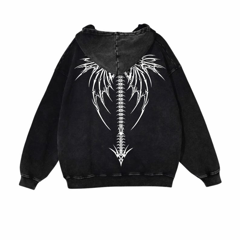 May include: Black hooded sweatshirt with a white graphic on the back. The design depicts a stylized spine and wing-like elements. The sweatshirt has long sleeves and a drawstring hood.
