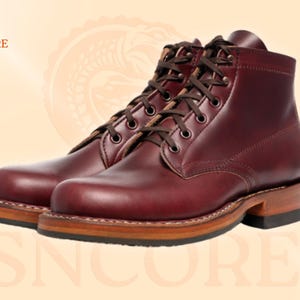May include: A pair of burgundy leather boots with brown laces. The boots have a classic design with a sturdy sole and a stacked heel. The brand logo "SNCORE" is visible in the upper left corner.