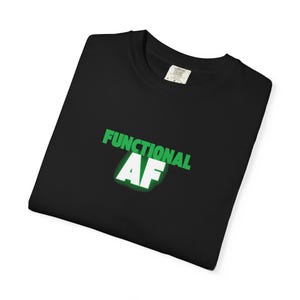 May include: Black t-shirt with the words "FUNCTIONAL AF" in green and white. The text is centered on the front of the shirt. The shirt is folded and appears to be made of a soft material.