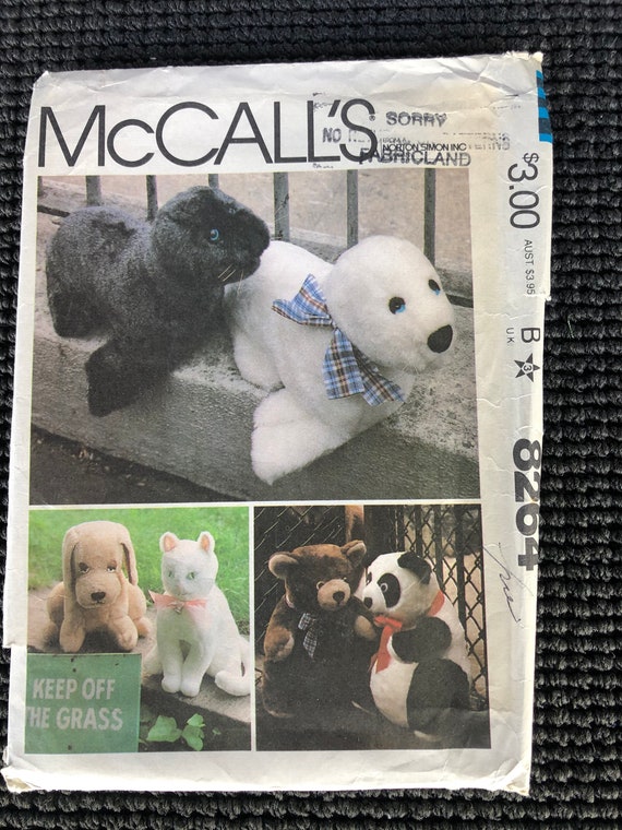 Uncut and factory fold. McCalls 8264 stuffed dog bear cat and seal pattern