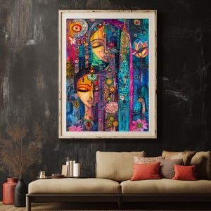 May include: A framed artwork depicting two stylised female faces with closed eyes, in vivid colours. The painting incorporates floral and geometric patterns, with a palette of blues, pinks, and oranges. The artwork is displayed above a beige sofa with red cushions.