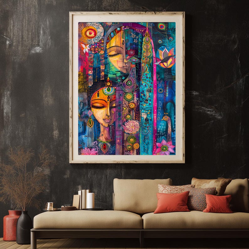 May include: A framed artwork depicting two stylised female faces with closed eyes, in vivid colours. The painting incorporates floral and geometric patterns, with a palette of blues, pinks, and oranges. The artwork is displayed above a beige sofa with red cushions.