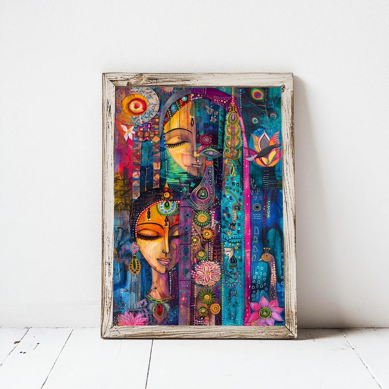 May include: A framed art print with a vibrant, abstract painting. The artwork shows two stylized female faces with closed eyes, decorated with detailed patterns and floral motifs. The colour scheme includes bright blues, pinks, and yellows.