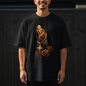 Men's Black Graphic T-Shirt with Praying Hands and Cross Design, Spiritual Casual Wear, Religious Fashion Tee, Comfortable Cotton Shirt