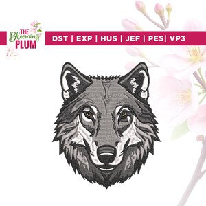 May include: A detailed embroidery design of a wolf's head, featuring shades of gray and white. The wolf's eyes are a warm brown. The design is set against a white background with the text "The Blooming Plum" and file type abbreviations.
