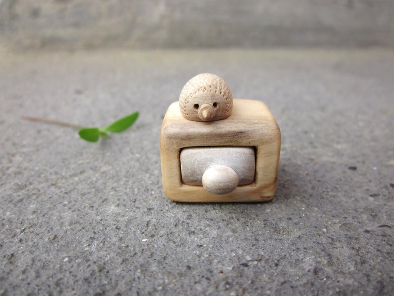 Miniature wooden box with drawer that can fit stud earrings. The box have a cute little hedgehog on the top. The miniature box and the drawer are hand carved from whole piece of wood with no glue used. Completely natural box made of reclaimed wood.