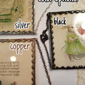 May include: Three framed vintage postcards with different colored frames: silver, copper, and black. The text on the postcards reads "Easter Greeting" and "caroling bird, singing bud and blossom whisper Easter message of mess and hope."