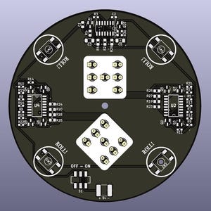 May include: A circular black circuit board with white components and text. The board features dice-shaped light arrays, integrated circuits, and the word "ROLL!" in white. It includes "OFF - ON" and "+9v -" labels.