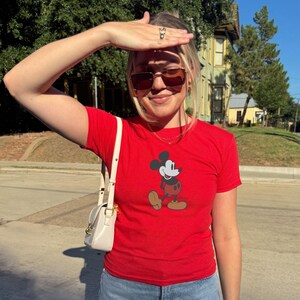 May include: A set of three ceramic mugs with a speckled, matte finish. Each mug is a different colour: light blue, cream, and grey. The mugs have a simple, modern design and a comfortable handle.