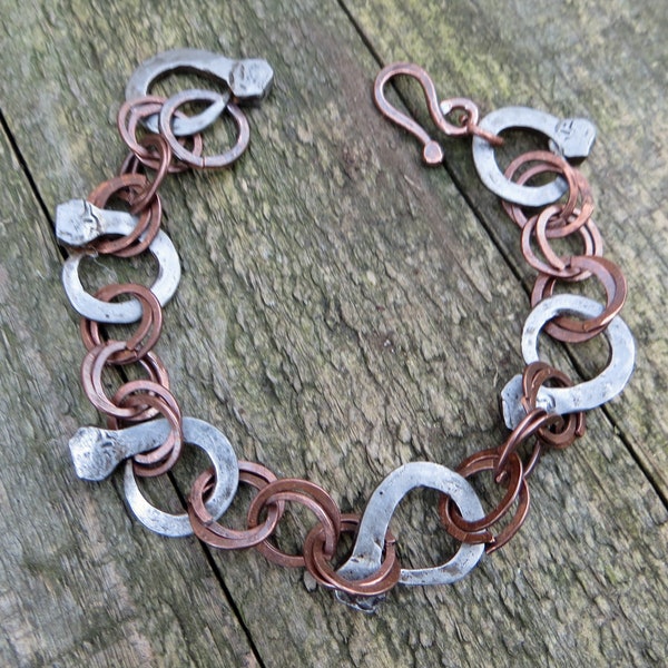 Hand formed horseshoe nail and copper hoops bracelet