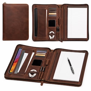 May include: A brown leather zippered portfolio case featuring an interior organizer with slots for a tablet, smartphone, credit cards, pens, and a charging cable, alongside a lined notepad and a metal ruler for precise document measurement.