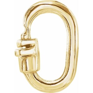 May include: Gold-toned metal clasp with a rounded oval shape and a small, decorative latch. This clasp is commonly used for jewellery making.