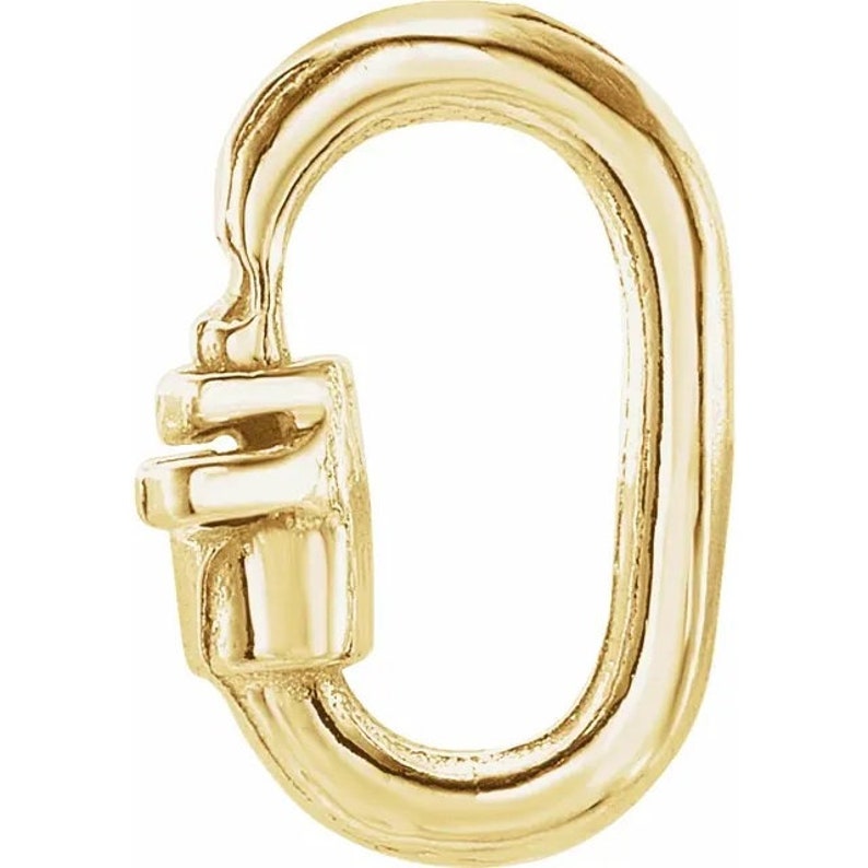 May include: Gold-toned metal clasp with a rounded oval shape and a small, decorative latch. This clasp is commonly used for jewellery making.