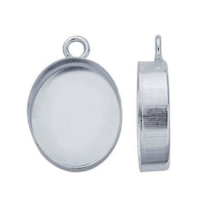 May include: Two silver-toned pendant settings with a round bezel for a cabochon stone. The settings have a loop at the top for attaching to a chain or cord.