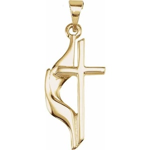 May include: Gold pendant necklace featuring a stylised depiction of a hand holding a cross. The cross is simple and elegant, with a smooth, polished finish.