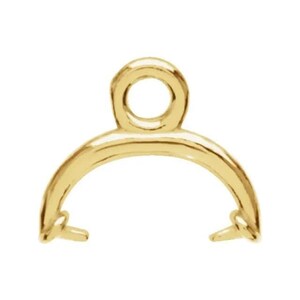 May include: A gold-colored jewelry finding with a circular loop at the top and a curved, semi-circular base. The base has two small, prong-like extensions on either end. The piece is likely used for attaching pendants or charms to necklaces or bracelets.