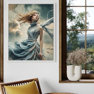 Può includere: Una stampa artistica incorniciata raffigurante una donna in un abito blu fluttuante con i capelli al vento. Lo sfondo include nuvole e una mappa. L'opera d'arte è esposta su una parete bianca vicino a una finestra.