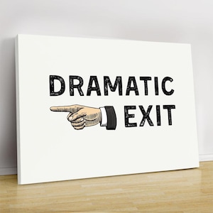 May include: White canvas art print featuring the words "DRAMATIC EXIT" in bold black letters. An illustration of a hand pointing to the left is positioned before the word "EXIT". The artwork is displayed on a white wall.