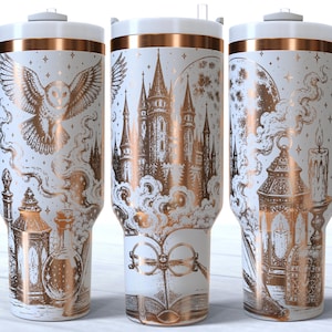 May include: A white insulated tumbler with a handle and a copper-coloured metallic design featuring a castle, an owl, round glasses, an open book, lanterns, and a candle. The tumbler has a white lid and a copper-coloured band near the top rim.