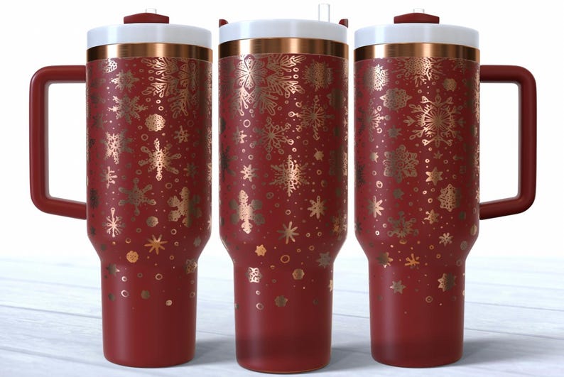 May include: Three red insulated tumblers with gold snowflake patterns. Each has a white lid, a copper band, and a red handle. These tumblers are designed for hot or cold drinks, ideal for festive occasions.