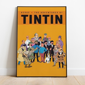 May include: A framed poster featuring a group of cartoon characters from "The Adventures of Tintin" against a yellow background. The title is in bold black letters above the characters. The characters are in various outfits.