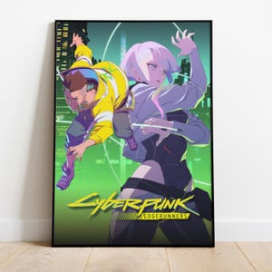 May include: A framed poster featuring two anime-style characters set against a neon green cityscape. One character wears a yellow jacket, the other a white jacket. The poster's title, "Cyberpunk Edgerunners," is displayed in yellow.