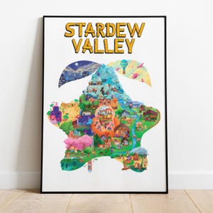 Op de afbeelding: Een ingelijste poster met de woorden "STARDEW VALLEY" in geel, omlijnd in zwart. De poster toont een kleurrijke kaart van een vallei met gebouwen, bomen en een rivier. De kaart heeft de vorm van een ster, tegen een witte achtergrond.