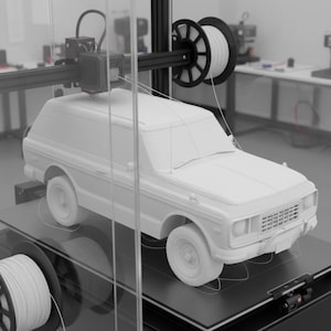May include: A 3D printer in operation, creating a white model of a vintage SUV. The printer head is moving across the vehicle, layer by layer. Spools of white filament are visible, along with the printer's mechanical components.